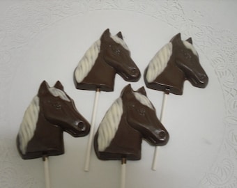 A dozen horse head lollipops