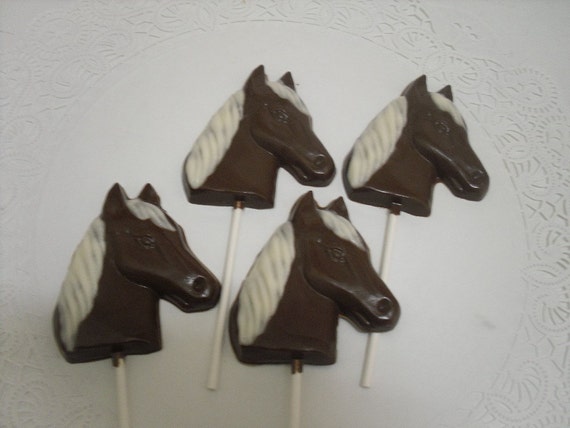 A dozen horse head lollipops