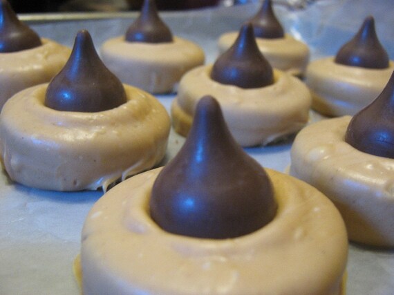 Peanut butter chocolate covered sandwich cookie with a kiss party favors