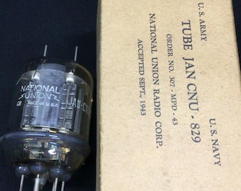 May include: A clear glass vacuum tube with metal pins at the base, labeled National Union and JAN-CNU-829, next to a tan cardboard box printed with U.S. ARMY, U.S. NAVY, TUBE JAN CNU-829, ORDER NO. 307-MPD-43, NATIONAL UNION RADIO CORP., ACCEPTED SEPT., 1943.