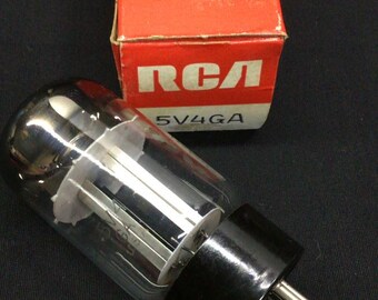 May include: An RCA 5V4GA electron tube with a clear glass bulb and a black base with metal pins. The tube is positioned in front of its original red and white cardboard box, which features the RCA logo and the model number 5V4GA printed on it.