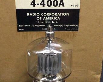 May include: An RCA 4-400A electron tube with a clear glass bulb and internal metal components, positioned in front of its original cardboard packaging. The box features red, white, and black text including the RCA logo and Radio Corporation of America.