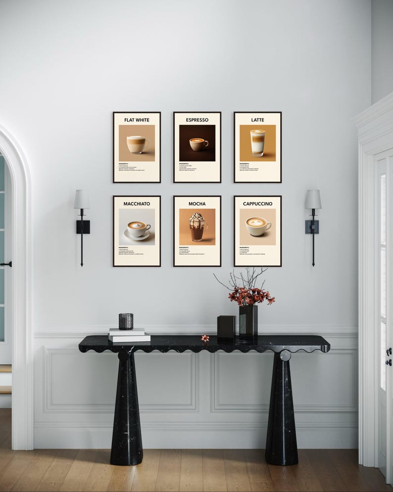 May include: Six framed prints of different coffee drinks, including flat white, espresso, latte, macchiato, mocha, and cappuccino. The prints are hung on a white wall above a black marble console table with a vase of red flowers.