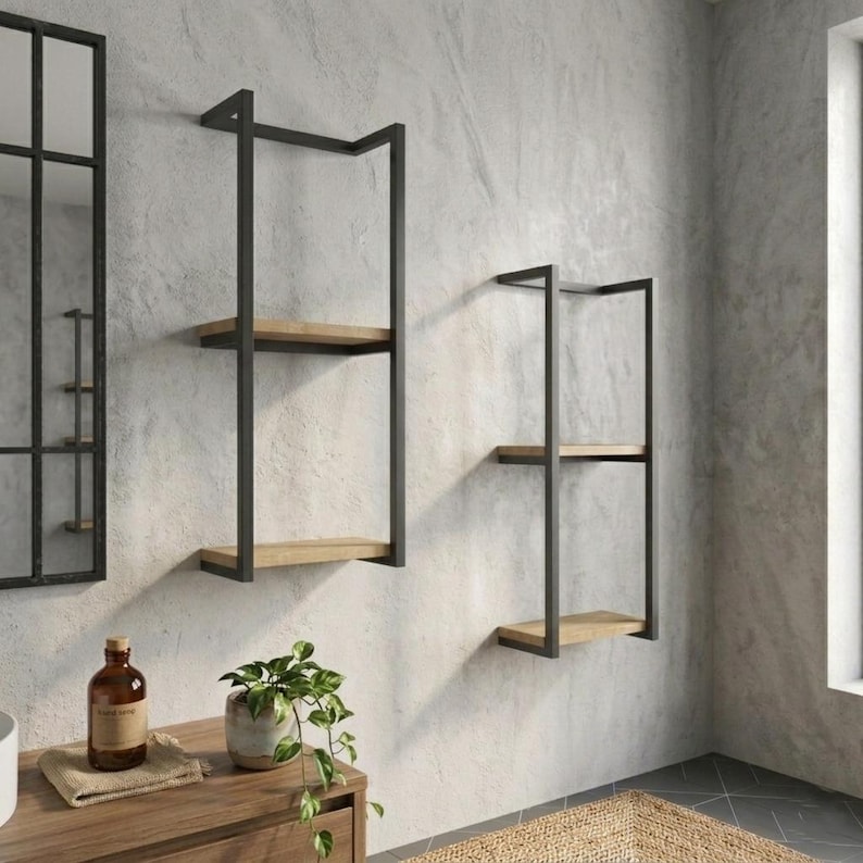 Black metal towel rack with folded towels display