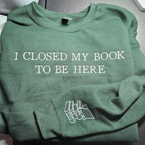 I closed my book to be here embroidered sweatshirt w/sleeve book stack