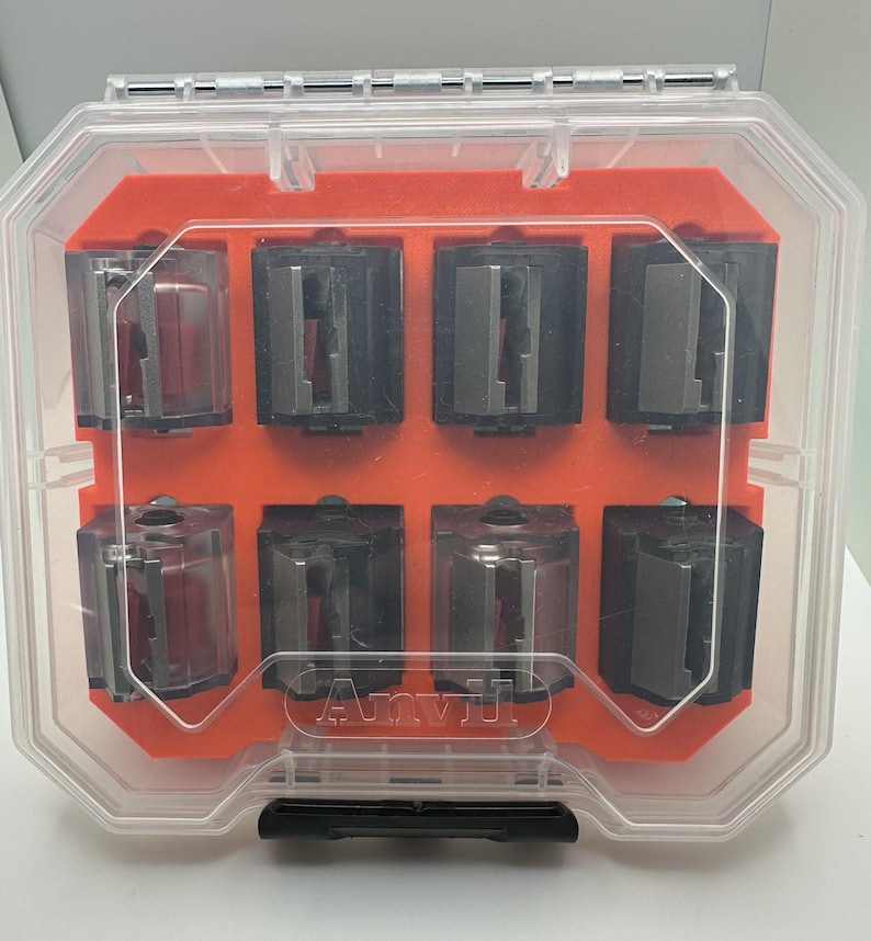 May include: A clear plastic storage case with an orange interior. The case contains eight small, clear plastic containers with black and silver components. The case has the word "Arvyl" printed on the front.