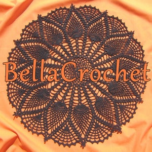 May include: A black crochet doily with a delicate, intricate design. The doily is circular and has a center with a starburst pattern. The doily is on a bright orange background.