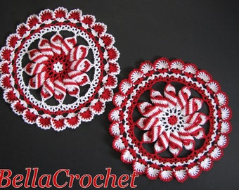 May include: Two handmade crochet doilies in red and white. The doilies have a spiral design in the centre, surrounded by a white openwork border and a scalloped red edge. The text "Bella Crochet" is at the bottom.