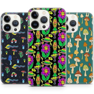 May include: Three clear phone cases with different colourful designs. The first case has a black background with a rainbow, mushrooms, and other psychedelic patterns. The second case has a black background with a repeating pattern of flowers, lava lamps, and planets. The third case has a green background with a repeating pattern of mushrooms.