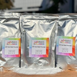 May include: Three silver foil bags of DTF Hot Melt Powder, each with a colorful label that says "MP Magic Print4U DTF Hot Melt Powder".