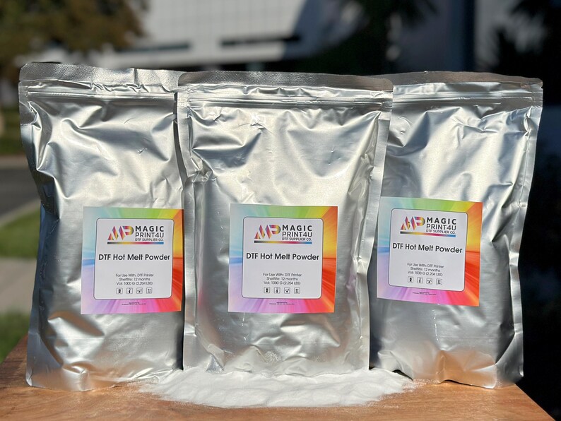 May include: Three silver foil bags of DTF Hot Melt Powder, each with a colorful label that says "MP Magic Print4U DTF Hot Melt Powder".