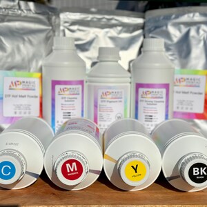 May include: Four bottles of CMYK ink, labeled with the color initials and names, are arranged in a row on a wooden surface.  The bottles are surrounded by bags of ink powder, labeled "DIY Hot Melt Powder" and "DIY Cleaning Solution".