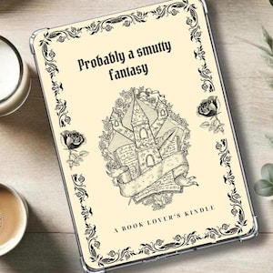 May include: A cream-colored Kindle cover with a black border and a decorative design featuring a castle, books, and roses. The text "Probably a smutty fantasy" and "A Book Lover's Kindle" are printed on the cover.