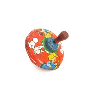 Peonza Wyandotte de acero prensado vintage, años 40, con niños y