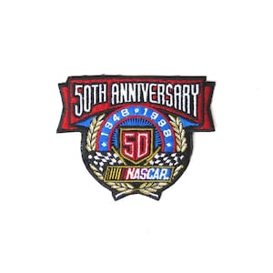 May include: A red, white, and blue embroidered patch celebrating the 50th anniversary of NASCAR. The patch features the years 1948 and 1998, the number 50, and the NASCAR logo.