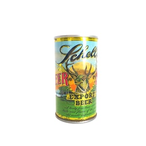 May include: A vintage aluminum can of Schell's Export Beer. The can features a colorful label with a deer illustration and the text "Schell's Export Beer".
