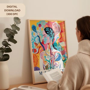 May include: A framed art print featuring a colorful illustration of a person with a vibrant, abstract design. The artwork includes shades of yellow, blue, red, and green. The text "DIGITAL DOWNLOAD (300 DPI)" is in the upper left corner. The word "M" is visible at the bottom.