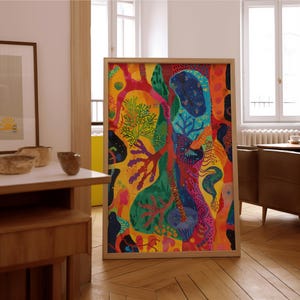 May include: A large, framed abstract painting with a vibrant colour palette. The artwork features a mix of organic shapes and patterns in shades of yellow, red, green, blue, and orange. The wooden frame complements the artwork's bold colours.