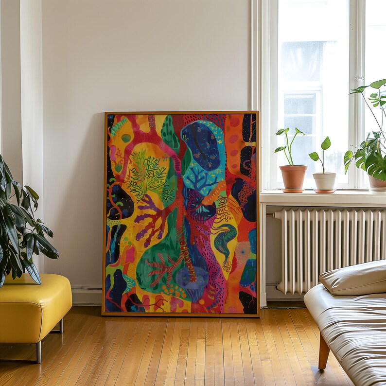 May include: A large, framed abstract painting with vibrant colours. The artwork features a mix of organic shapes and patterns in shades of yellow, red, blue, and green. The wooden frame adds a classic touch to the modern art piece.