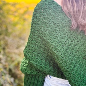 Versatile Crochet Wrap Sweater Scarf Design Green Yarn Material Handmade Winter Accessory Three Size Options Custom Fit Selection Textured Stitch Pattern Long Sleeve Detail Cozy Neck Warmer Forest Green Color Soft Acrylic Yarn Fashion