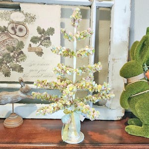 May include: A rustic wooden sign with the text "Welcome to our home" in white lettering. The sign features a distressed finish and a simple, inviting design, perfect for entryway decor.