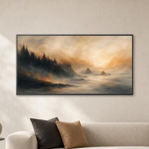 May include: A rectangular landscape wall art piece in a black frame featuring a misty coastal scene with dark evergreen trees along a rocky shoreline, transitioning into a soft, golden-hued sky over a calm, foggy ocean surface.