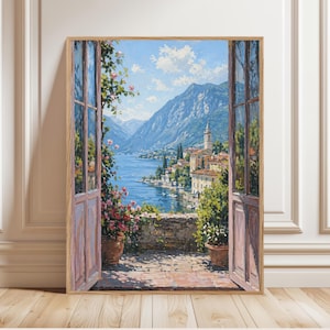 May include: A framed painting depicts a scenic view through an open doorway. The artwork showcases a serene lake surrounded by mountains and a quaint village. The foreground features potted plants and a brick patio, with the door painted in soft pink.