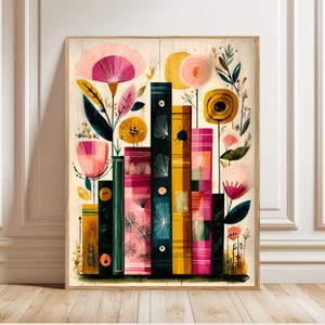 May include: A framed art print depicting a colourful illustration of stylised books and flowers. The books are in shades of pink, yellow, and teal, with floral accents. The background is a light wood grain.