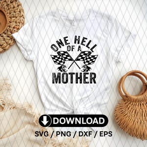 May include: White t-shirt with black text that reads "One Hell of a Mother" with two black and white checkered flags crossed behind the text.