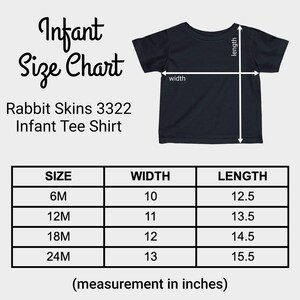 May include: A black infant tee shirt with a size chart. The chart shows measurements in inches for sizes 6M to 24M. The shirt is labeled as Rabbit Skins 3322 Infant Tee Shirt.
