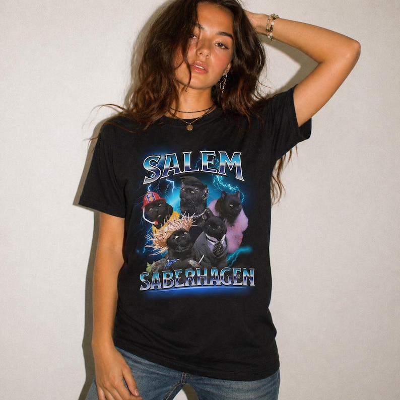 Unleash your dark humor and nostalgia with our Salem Saberhagen Shirt, a perfect tribute to the beloved 90s TV sitcom Sabrina the Teenage Witch. Featuring everyone's favorite sarcastic, spell-casting feline, this Salem tee is a must-have for fans of 90s nostalgia, witchy vibes, and sassy talking cats. Whether you're reminiscing about the y2k era, looking for a fun Halloween costume, or adding some witchy humor to your everyday wardrobe, this shirt has you covered!