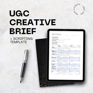 May include: A digital tablet displaying a creative brief template, with a black pen and a black notebook. The text on the tablet reads "Concept Title" and "Script Brief List". The background is a light gray.