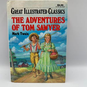 Op de afbeelding: Een vintage exemplaar van "De avonturen van Tom Sawyer" van Mark Twain. De boekomslag toont een illustratie van twee kinderen die op een pad lopen. De titel staat in grote rode letters, met de serietitel "Great Illustrated Classics" erboven.