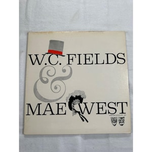 May include: A vintage album cover featuring the names "W.C. FIELDS" and "MAE WEST" in bold black letters. A top hat with a red band and a stylized hat with a bow are above and below the ampersand. The album cover is off-white.