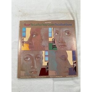 May include: A white ceramic mug with a black handle and the text "But First, Coffee" in a black, bold font. The mug is on a white surface. The mug is approximately 4 inches tall.