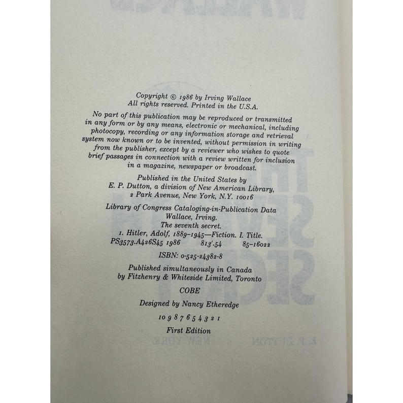 May include: A book page with printed text. The text includes the copyright information for a book titled "The seventh secret" by Irving Wallace, published in 1986. The page also lists the ISBN and Library of Congress data.