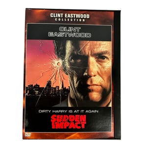 May include: DVD case for the movie "Sudden Impact" from the Clint Eastwood Collection. The cover features a close-up of Clint Eastwood's face with a cracked glass effect. The title "Sudden Impact" is in red block letters.