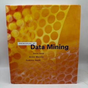 May include: A hardcover textbook titled Principles of Data Mining by David Hand, Heikki Mannila, and Padhraic Smyth. The cover features a bright orange and yellow background with a repeating circular honeycomb pattern across the entire surface.