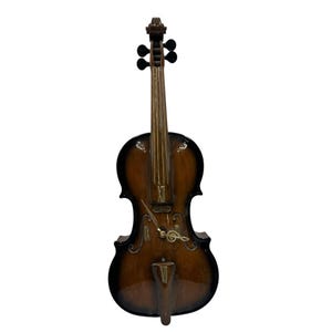 May include: A decorative violin-shaped clock with a brown and black finish. The clock features a gold-colored clock face with Roman numerals and a treble clef design. The word "Rhythm" is printed on the clock.