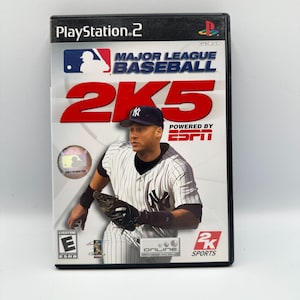 May include: A PlayStation 2 video game case for "Major League Baseball 2K5." The cover features a baseball player in a Yankees uniform, the game's title in red, and the ESPN logo. The case is black with the PlayStation 2 logo.