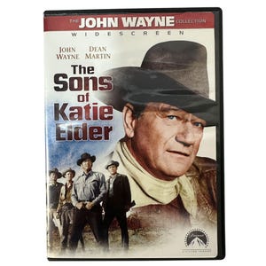 Peut inclure: Boîtier DVD pour "Les Fils de Katie Elder" de la collection John Wayne. La couverture présente John Wayne avec un chapeau de cowboy, d'autres acteurs et le titre du film. Le logo Paramount Pictures est visible.