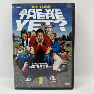 May include: DVD of the family comedy film "Are We There Yet?" starring Ice Cube. The cover features a group of people, including children, and the film's title in large white letters against a blue background.