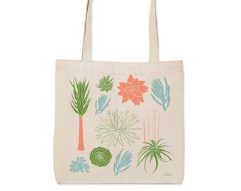 May include: A beige tote bag with a design of various succulents in shades of green, blue, and pink. The succulents are arranged in a circular pattern on the bag.