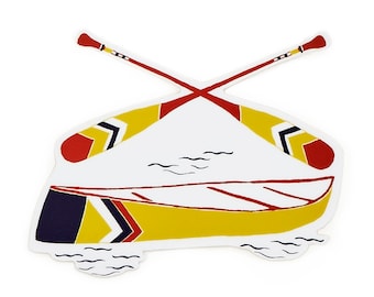 May include: A yellow canoe with red and black stripes and two red and yellow paddles crossed over the top. The canoe is on a white background with blue wavy lines representing water.