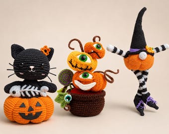 May include: Three crocheted Halloween figures: a black cat sitting on an orange jack-o'-lantern holding a fish skeleton, a brown pot containing three stacked orange pumpkins with green eyes, and a pumpkin figure wearing a black witch hat.