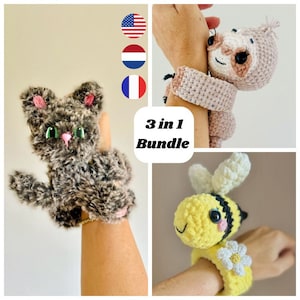 May include: A 3-in-1 bundle of crochet wristbands featuring a gray cat, a pink sloth, and a yellow bee. The cat has pink ears and a pink nose. The sloth is light pink. The bee has black stripes and a white flower.
