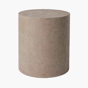 May include: A cylindrical, beige-colored concrete side table. The table has a textured surface and a flat top. The design is minimalist and modern, suitable for indoor or outdoor use. The table is approximately 18 inches in height and 14 inches in diameter.