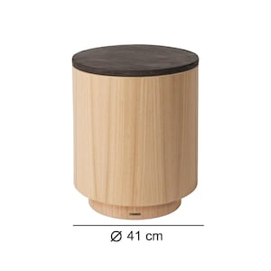May include: A cylindrical wooden side table with a dark brown top. The table has a light wood grain finish and a diameter of 16 inches. The design is modern and minimalist, suitable for various interior styles.