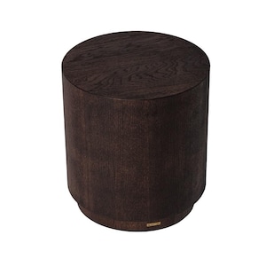May include: A dark brown, cylindrical wooden side table. The table has a round top and a slightly wider base. The wood grain is visible, giving it a natural look. The design is simple and modern, suitable for various interior styles.