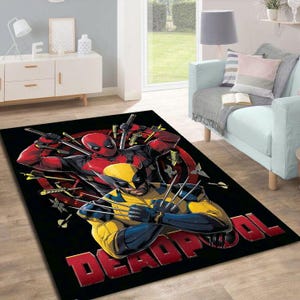 May include: Black area rug with a graphic print of Deadpool and Wolverine. The rug features a red and black Deadpool with a yellow and black Wolverine in front of him. The rug has the word "DEADPOOL" printed in red and black letters.